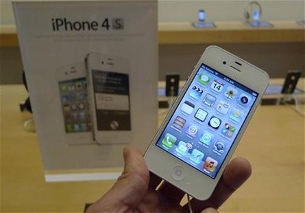 An iPhone 4S is shown on display at an Apple Store in Clarendon An iPhone 4S is shown on display at an Apple Store in Clarendon