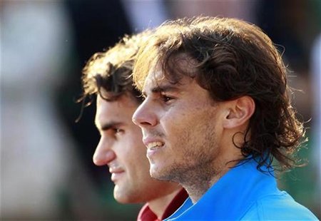 Nadal of Spain and Federer of Switzerland attends the trophy ceremony after their men's final at the French Open tennis tournament Nadal of Spain and Federer of Switzerland attends the trophy ceremony after their men's final at the French Open tennis tournament
