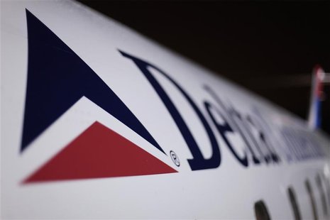 A Delta plane sits on a runway prior to takeoff at John F Kennedy International Airport in New York A Delta plane sits on a runway prior to takeoff at John F Kennedy International Airport in New York