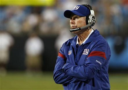 New York Giants head coach Tom Coughlin watches his team in action against the Carolina Panthers in a NFL pre-season football game in Charlo New York Giants head coach Tom Coughlin watches his team in action against the Carolina Panthers in a NFL pre-season football game in Charlo
