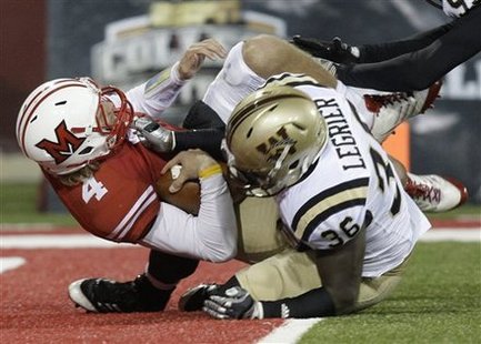 Miami (Ohio) quarterback Zac Dysert (4) is sacked near the goal line by Western Michigan defensive end Deauntay Legrier (36) in the second half of an NCAA college football game Wednesday, Nov. 16, 2011, in Oxford, Ohio. Western Michigan won 24-21.
Miami (Ohio) quarterback Zac Dysert (4) is sacked near the goal line by Western Michigan defensive end Deauntay Legrier (36) in the second half of an NCAA college football game Wednesday, Nov. 16, 2011, in Oxford, Ohio. Western Michigan won 24-21.