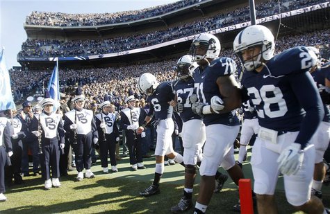 Penn State football players Derek Moye, Quinn Barham, Devon Still, and Drew Astorino enter the field prior to their NCAA football game again Penn State football players Derek Moye, Quinn Barham, Devon Still, and Drew Astorino enter the field prior to their NCAA football game again