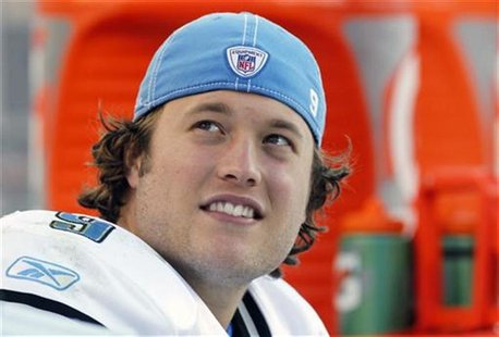 Detroit Lions quarterback Matthew Stafford smiles on the sidelines after being taken out late in their NFL footbal game against the Denver Detroit Lions quarterback Matthew Stafford smiles on the sidelines after being taken out late in their NFL footbal game against the Denver