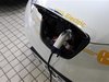 A Nissan Leaf electric car charges at the Dah Chong Hong showroom in Hong Kong