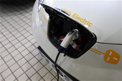 A Nissan Leaf electric car charges at the Dah Chong Hong showroom in Hong Kong A Nissan Leaf electric car charges at the Dah Chong Hong showroom in Hong Kong