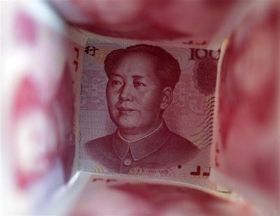 File picture illustration shows a 100 yuan note surrounded by other 100 yuan notes in Beijing File picture illustration shows a 100 yuan note surrounded by other 100 yuan notes in Beijing