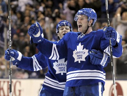 Maple Leafs defenseman Franson celebrates his goal in front of teammate defenseman Carl Gunnarsson during their NHL hockey game in Toronto Maple Leafs defenseman Franson celebrates his goal in front of teammate defenseman Carl Gunnarsson during their NHL hockey game in Toronto