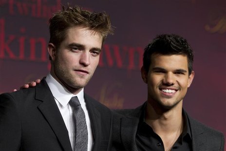 Cast members Pattinson and Lautner pose before the German premiere of the movie "Twilight Saga: Breaking Dawn" in Berlin Cast members Pattinson and Lautner pose before the German premiere of the movie "Twilight Saga: Breaking Dawn" in Berlin