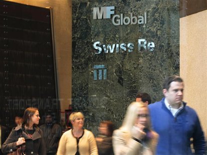 People walk through the office complex where MF Global Holdings Ltd have an office on 52nd Street in midtown Manhattan New York People walk through the office complex where MF Global Holdings Ltd have an office on 52nd Street in midtown Manhattan New York