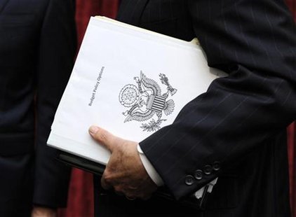 Congressional Super Committee member Sen. Jon Kyl (R-AZ) carries a binder titled Budget Policy Options as he departs the inaugural meeting, Congressional Super Committee member Sen. Jon Kyl (R-AZ) carries a binder titled Budget Policy Options as he departs the inaugural meeting,