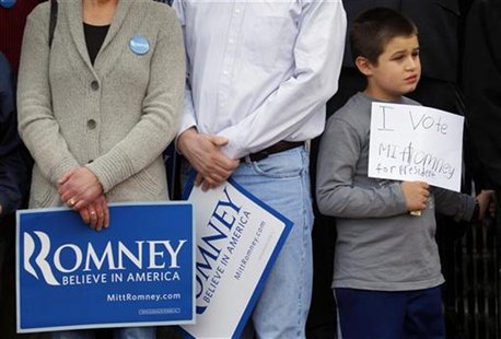 A young supporter holds a handwritten sign for Republican presidential candidate Romney at a campaign rally in Nashua A young supporter holds a handwritten sign for Republican presidential candidate Romney at a campaign rally in Nashua