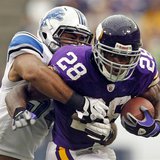 Minnesota Vikings running back Peterson is tackled by Detroit Lions line backer Levy during their NFC football game in Minneapolis Minnesota Vikings running back Peterson is tackled by Detroit Lions line backer Levy during their NFC football game in Minneapolis