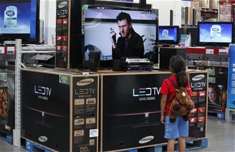 A child looks at a flat screen television at a Sam's Club, a division of Wal-Mart stores in Bentonville A child looks at a flat screen television at a Sam's Club, a division of Wal-Mart stores in Bentonville
