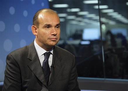 Former CEO of Olympus Michael Woodford sits in a television studio before an interview with Reuters in London Former CEO of Olympus Michael Woodford sits in a television studio before an interview with Reuters in London