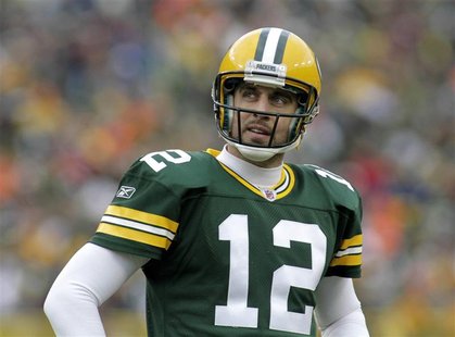 Green Bay Packers' Aaron Rodgers checks the clock against the Tampa Bay Buccaneers in the second half during their NFL football game in Gree Green Bay Packers' Aaron Rodgers checks the clock against the Tampa Bay Buccaneers in the second half during their NFL football game in Gree