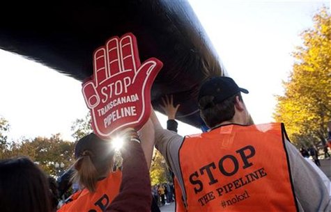 Demonstrators call for the cancellation of the Keystone XL pipeline during a rally in front of the White House in Washington Demonstrators call for the cancellation of the Keystone XL pipeline during a rally in front of the White House in Washington