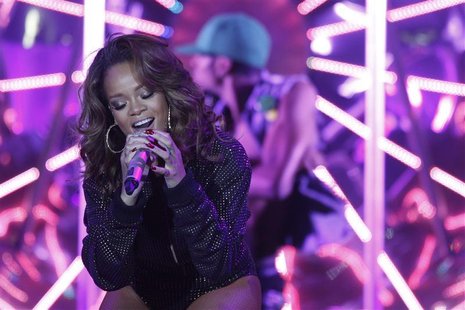 Singer Rihanna performs during a concert as part of her tour for her latest album "Loud" in Nilson Nelson gymnasium in Brasilia Singer Rihanna performs during a concert as part of her tour for her latest album "Loud" in Nilson Nelson gymnasium in Brasilia