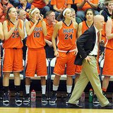 Hope College Women's Basketball Coach Brian Morehouse paces in front of his players while watching game action at DeVos Fieldhouse in Holland. (photo courtesy Hope College)