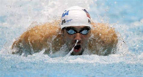 Phelps of the US starts in men's 100m butterfly qualifying event at Short Course Swimming World Cup in Berlin Phelps of the US starts in men's 100m butterfly qualifying event at Short Course Swimming World Cup in Berlin
