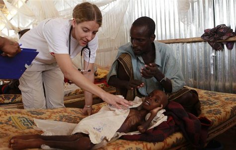 Paramedic from MSF attends to malnourished male refugee At the MSF stabilization centre in Melka Dida Paramedic from MSF attends to malnourished male refugee At the MSF stabilization centre in Melka Dida