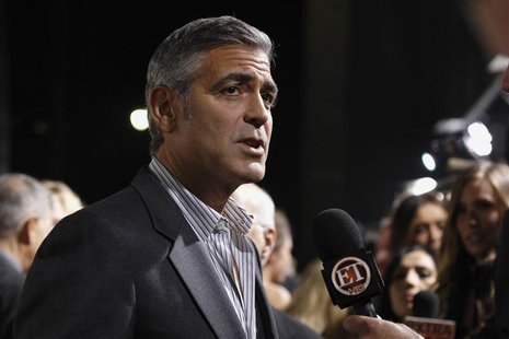 Clooney is interviewed at the premiere of "The Descendants" at the Samuel Goldwyn Theater in Beverly Hills Clooney is interviewed at the premiere of "The Descendants" at the Samuel Goldwyn Theater in Beverly Hills