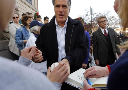 Republican presidential candidate and former Massachusetts Governor Mitt Romney greets supporters at a campaign rally in Nashua Republican presidential candidate and former Massachusetts Governor Mitt Romney greets supporters at a campaign rally in Nashua