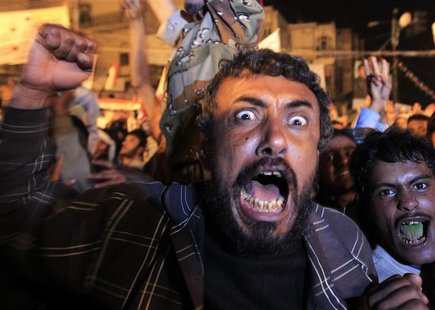 Anti-government protesters react as they celebrate the signing by Yemen's President Ali Abdullah Saleh of a deal to step down in Sanaa Anti-government protesters react as they celebrate the signing by Yemen's President Ali Abdullah Saleh of a deal to step down in Sanaa