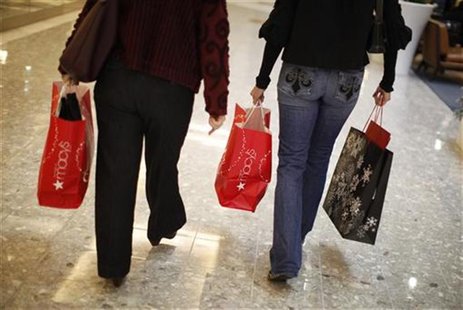 Shoppers carry their purchases during the Black Friday sales at a shopping mall in Tysons Corner Shoppers carry their purchases during the Black Friday sales at a shopping mall in Tysons Corner