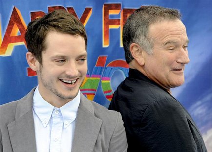 Elijah Wood and Robin Williams arrive at the premiere of "Happy Feet Two" in the Hollywood area of Los Angeles Elijah Wood and Robin Williams arrive at the premiere of "Happy Feet Two" in the Hollywood area of Los Angeles