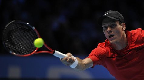 Berdych of the Czech Republic hits a return to Ferrer of Spain during their singles tennis match at the ATP World Tour Finals in London Berdych of the Czech Republic hits a return to Ferrer of Spain during their singles tennis match at the ATP World Tour Finals in London