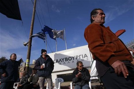 Workers of the Hellenic Steel Company stand outside a factory during a strike at Aspropyrgos Workers of the Hellenic Steel Company stand outside a factory during a strike at Aspropyrgos