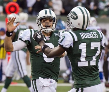 Jets' Sanchez celebrates with Burress after he threw a pass to Holmes for what proved to be the winning touchdown against the Bills in their Jets' Sanchez celebrates with Burress after he threw a pass to Holmes for what proved to be the winning touchdown against the Bills in their