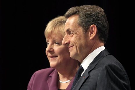 France's President Nicolas Sarkozy (R) and Germany's Chancellor Angela Merkel attend a joint press conference on the eve of a G20 summit of France's President Nicolas Sarkozy (R) and Germany's Chancellor Angela Merkel attend a joint press conference on the eve of a G20 summit of