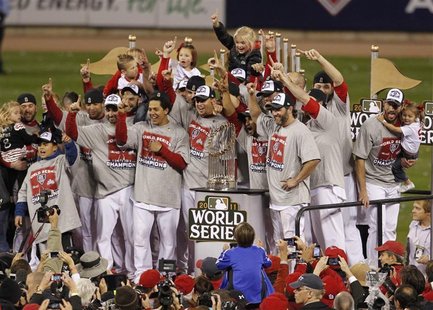 St. Louis Cardinals players celebrate wth the World Series trophy after they defeated the Texas Rangers in Game 7 to win MLB's World Series St. Louis Cardinals players celebrate wth the World Series trophy after they defeated the Texas Rangers in Game 7 to win MLB's World Series