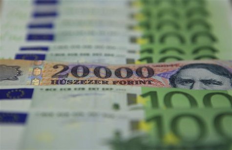 An illustration picture shows a 20000 Hungarian Forint banknote among 100 Euro banknotes in OTP bank in Budapest An illustration picture shows a 20000 Hungarian Forint banknote among 100 Euro banknotes in OTP bank in Budapest