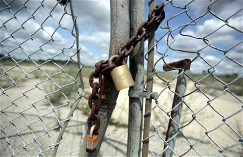 A chain-locked gate keeps visitors out of what was once a sprawling industrial complex known as Buick City near downtown Flint, Michigan A chain-locked gate keeps visitors out of what was once a sprawling industrial complex known as Buick City near downtown Flint, Michigan