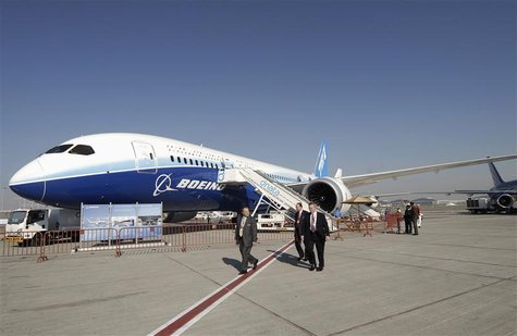 Visitors walk by a Boeing 787-8 Dreamliner during the second day of the Dubai Airshow Visitors walk by a Boeing 787-8 Dreamliner during the second day of the Dubai Airshow