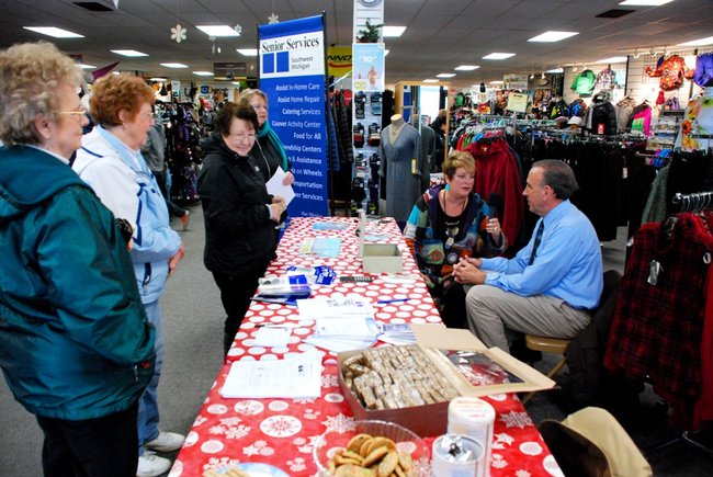 Lori Moore brings the Potluck Pals to Lee's Sporting Goods to raise money for Senior Services - the Pals raised $1325 - enough to provide 700 meals!