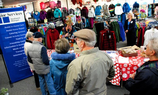Lori Moore brings the Potluck Pals to Lee's Sporting Goods to raise money for Senior Services - the Pals raised $1325 - enough to provide 700 meals!