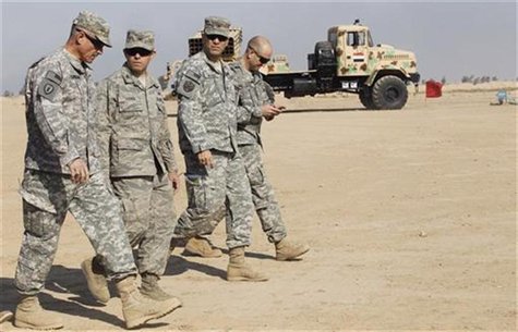 U.S. soldiers walk near a rocket launcher missile at Basmaya military base in Baghdad U.S. soldiers walk near a rocket launcher missile at Basmaya military base in Baghdad