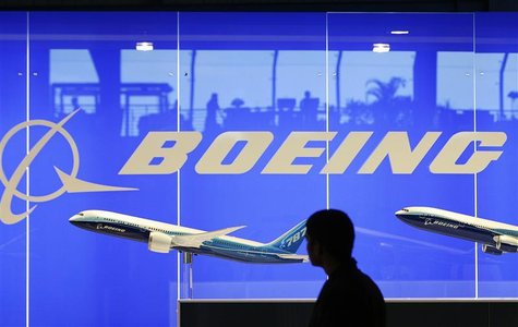 A man looks at a scale model of Boeing's 787 dreamliner at their booth at the Singapore Air Show in Singapore A man looks at a scale model of Boeing's 787 dreamliner at their booth at the Singapore Air Show in Singapore