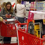 (REUTERS) A woman uses her smartphone as she waits in line to checkout at a Target store on the shopping day dubbed ''Black Friday'' in Torrington, Connecticut, November 25, 2011. (REUTERS) A woman uses her smartphone as she waits in line to checkout at a Target store on the shopping day dubbed ''Black Friday'' in Torrington, Connecticut, November 25, 2011.