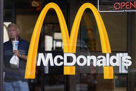 A man carries his food as he leaves a McDonald's restaurant in Arlington,Virginia A man carries his food as he leaves a McDonald's restaurant in Arlington,Virginia