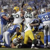 Green Bay Packers Evan Dietrich-Smith raises his arms to celebrate a touch down by Packers full back John Kuhn against the Detroit Lions dur Green Bay Packers Evan Dietrich-Smith raises his arms to celebrate a touch down by Packers full back John Kuhn against the Detroit Lions dur