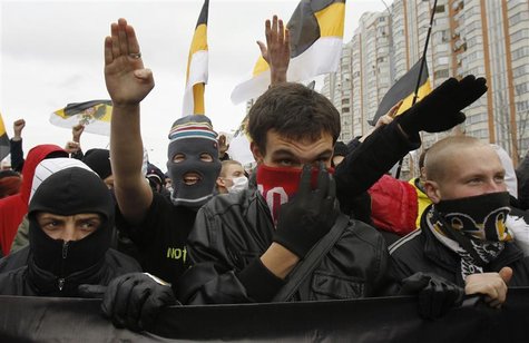 Russia's ultra-nationalists gesture during a "Russian March" demonstration on National Unity Day in Moscow Russia's ultra-nationalists gesture during a "Russian March" demonstration on National Unity Day in Moscow