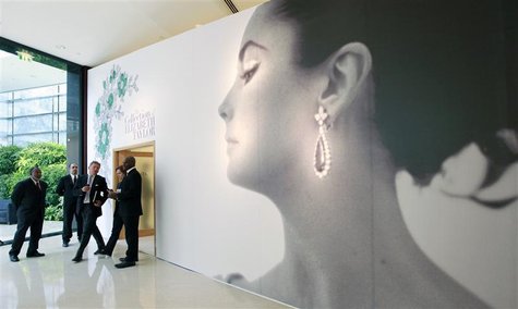 Visitors walk past the entrance of Christie's auction of The Collection of Elizabeth Taylor in Dubai Visitors walk past the entrance of Christie's auction of The Collection of Elizabeth Taylor in Dubai
