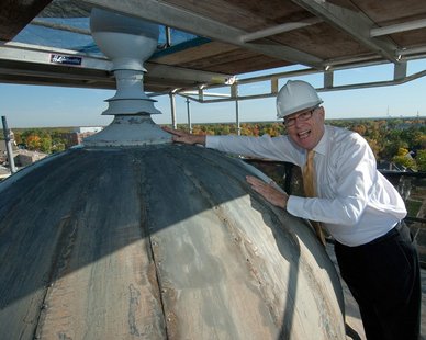 UWSP chancellor Bernie Patterson touches the top of the cupola. (Photo courtesy UWSP) UWSP chancellor Bernie Patterson touches the top of the cupola. (Photo courtesy UWSP)
