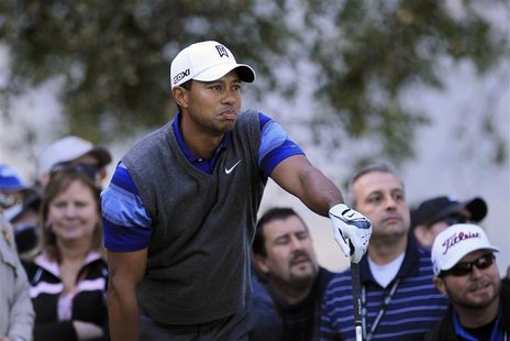 Woods of the U.S. watches his tee shot on the second hole during the second round of the Chevron World Challenge PGA golf tournament in Thou Woods of the U.S. watches his tee shot on the second hole during the second round of the Chevron World Challenge PGA golf tournament in Thou