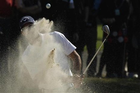 Quiros of Spain hits from a bunker on the second hole during the third round of the Hong Kong Open golf tournament at the Hong Kong golf clu Quiros of Spain hits from a bunker on the second hole during the third round of the Hong Kong Open golf tournament at the Hong Kong golf clu