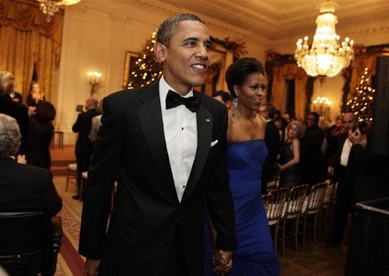 President Barack Obama and first lady Michelle Obama leave after the Kennedy Center Honors reception President Barack Obama and first lady Michelle Obama leave after the Kennedy Center Honors reception